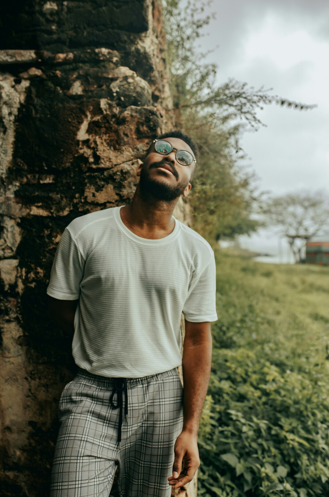 Portrait of a British Pakistani man with glasses and a short beard