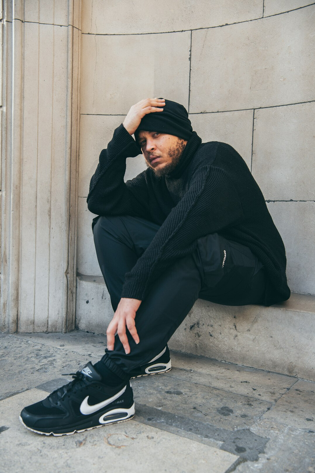 Portrait of a British East Asian man in a black turtleneck
