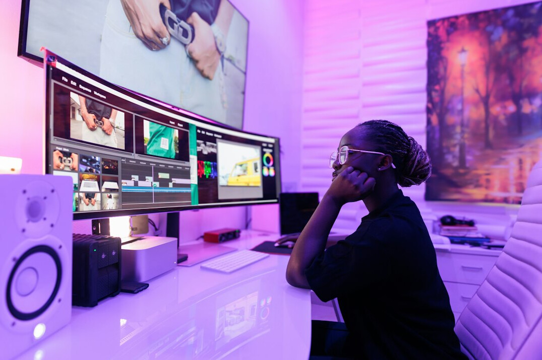 Broadcast control room with multiple monitors showing live video feeds